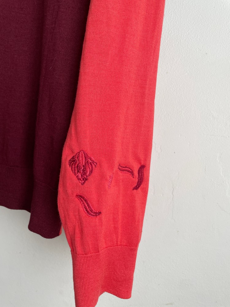 satin and running stitch leaves in pink and Burgundy on pink fine knitted fabric