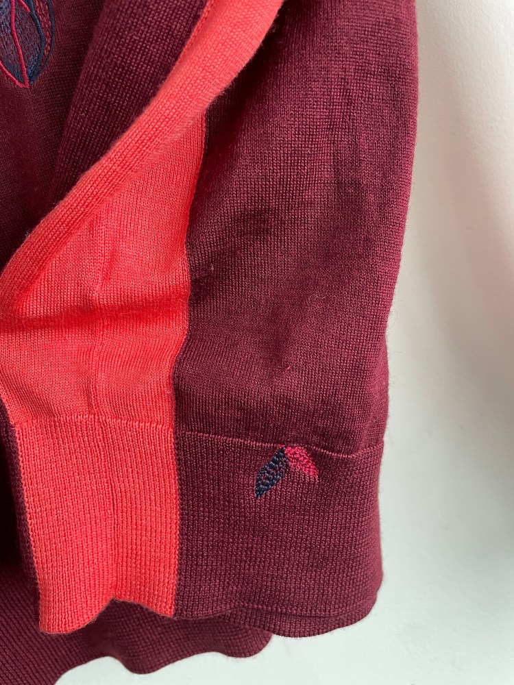 running stitch leaves in pink and navy on burgundy fine knitted fabric